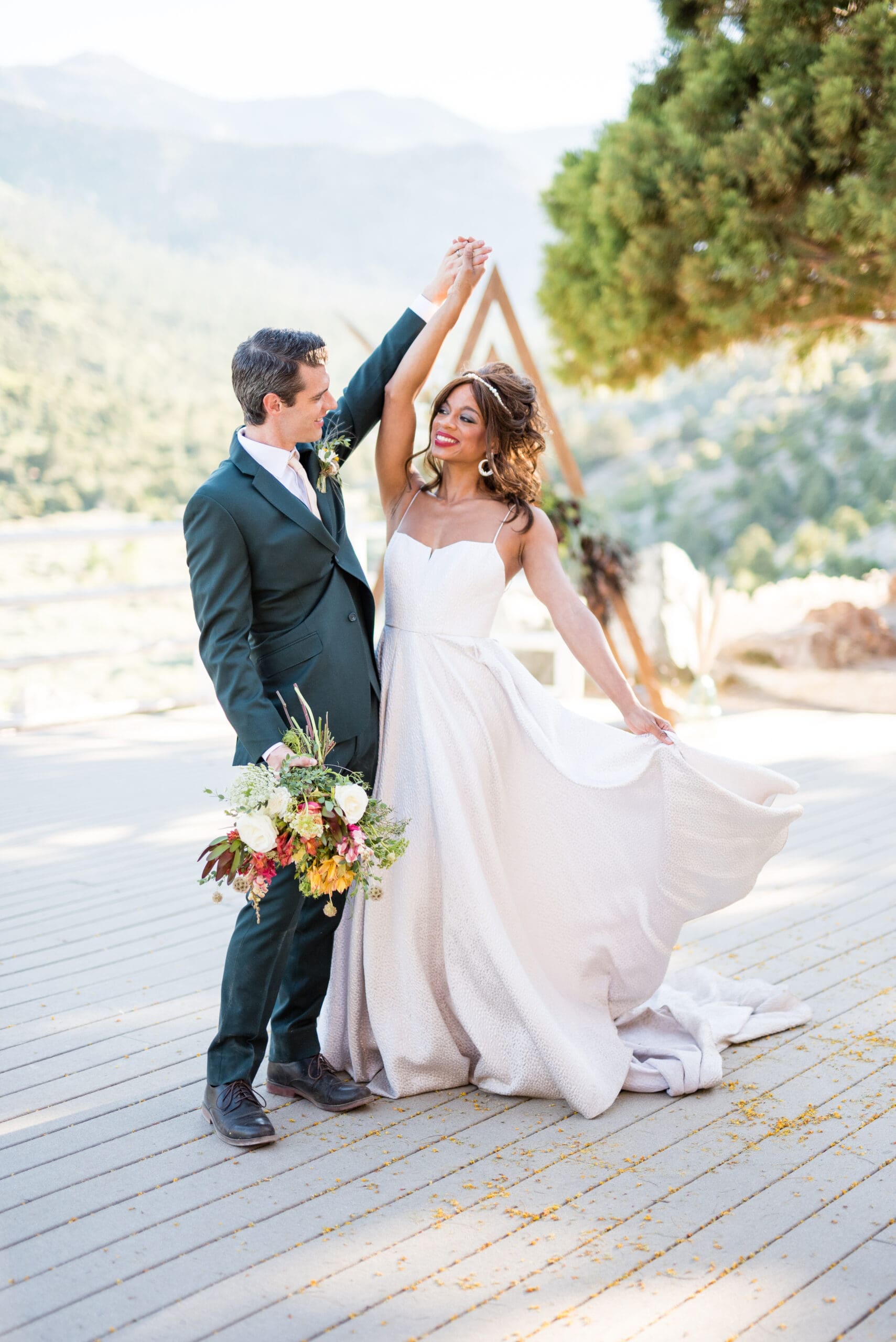 Bride and groom share an emotional first dance at The Retreat on Charleston Peak, surrounded by stunning mountain views.